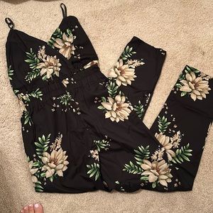 EUC polyester pant onsie. Black w cream flowers and greenery. Has pockets! Sexy!